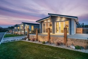 Night time exterior image of the luxury lodges at Trevornick